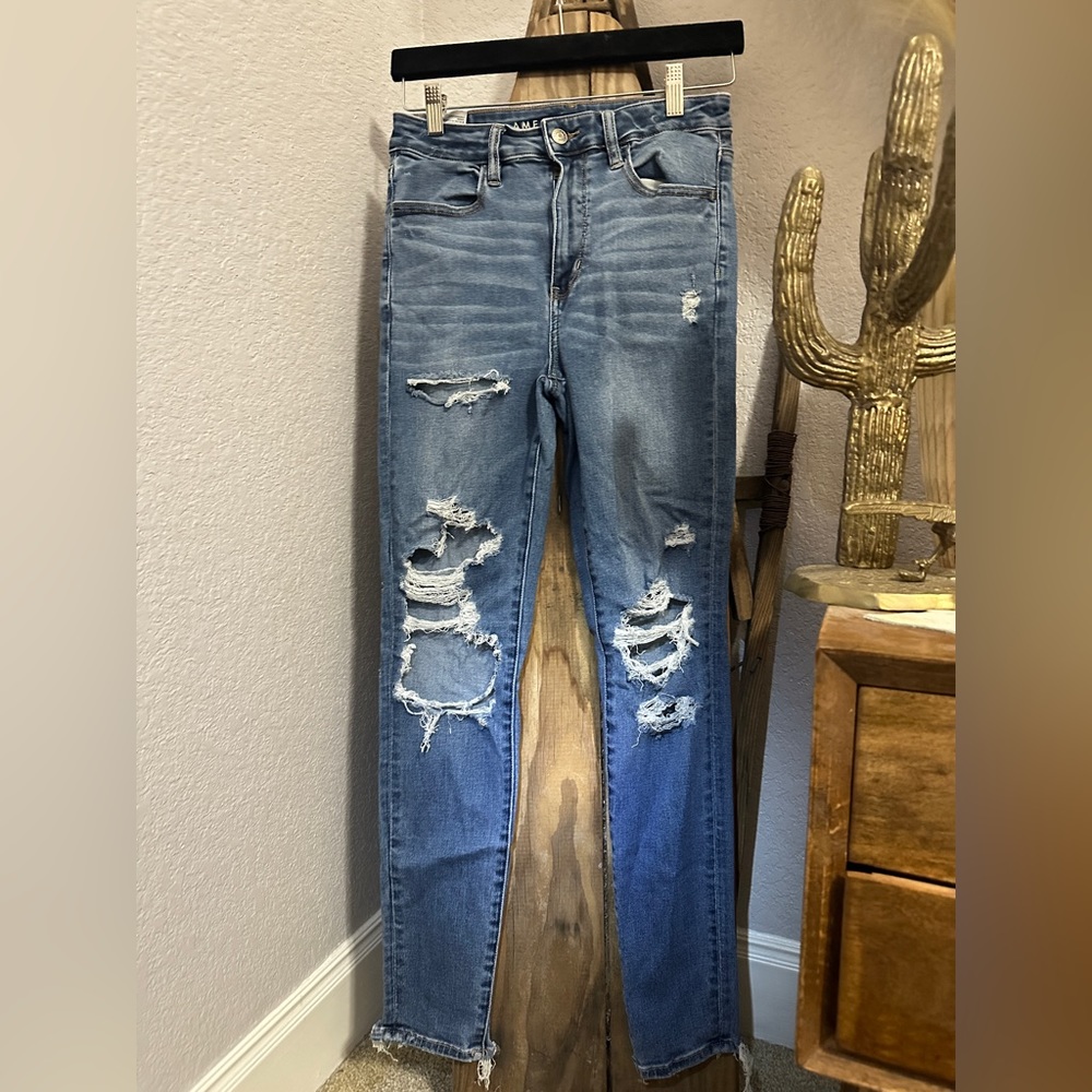Medium wash American Eagle distressed skinny jeans